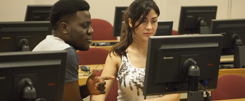 Adesina Tony Dada, left, a junior majoring in mechanical engineering, works with Ximena Horness, a graduate student in accounting, to prepare his tax return as part of a program available to South students, faculty and staff.